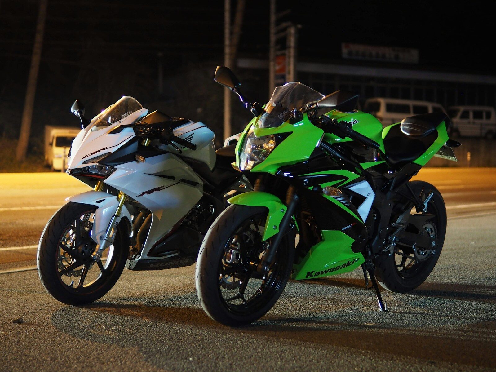 man in green and black sports bike